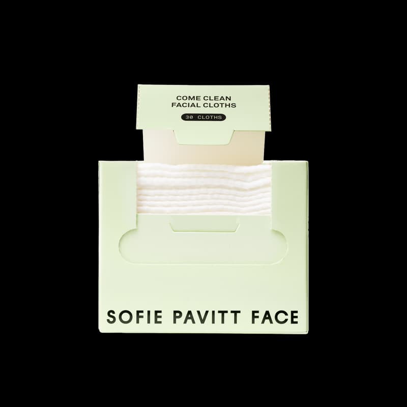 Light green box of Sofie Pavitt Face Come Clean Facial Cloths displaying 30 stacked white towels inside.