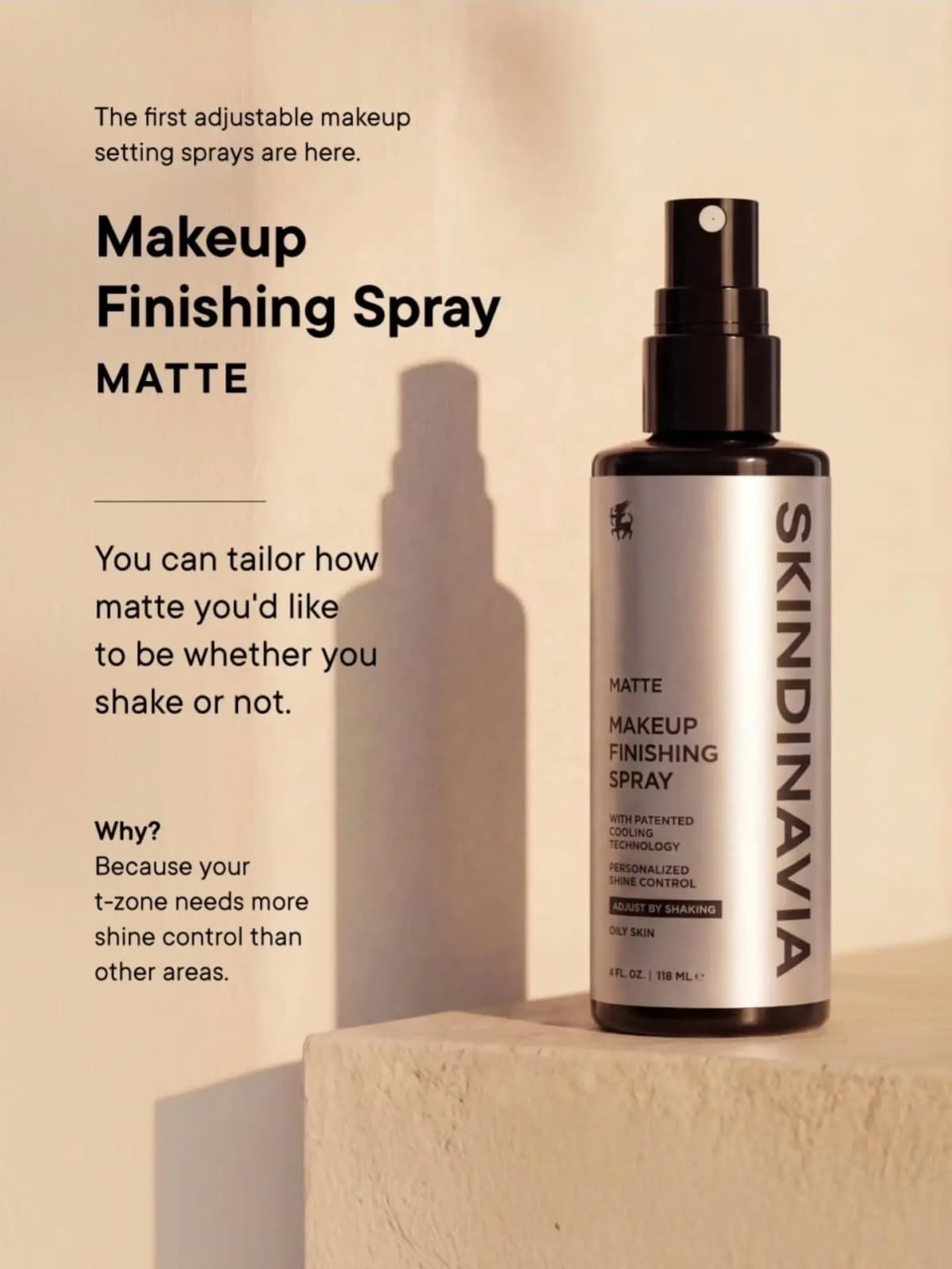 Silver Skindinavia Matte Makeup Finishing Spray on a beige block, casting a long shadow on the wall