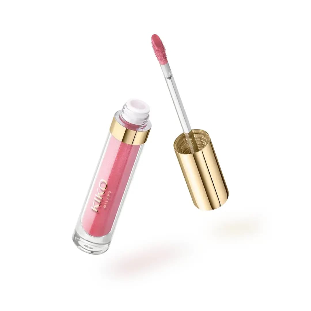 Clear lip gloss tube with shimmering pink formula, gold collar and doe-foot applicator
