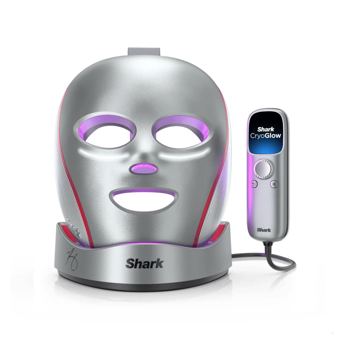 Shark CryoGlow LED Face Mask Kevin Hart Collab in gunmetal and red on its base, glowing purple, beside its remote