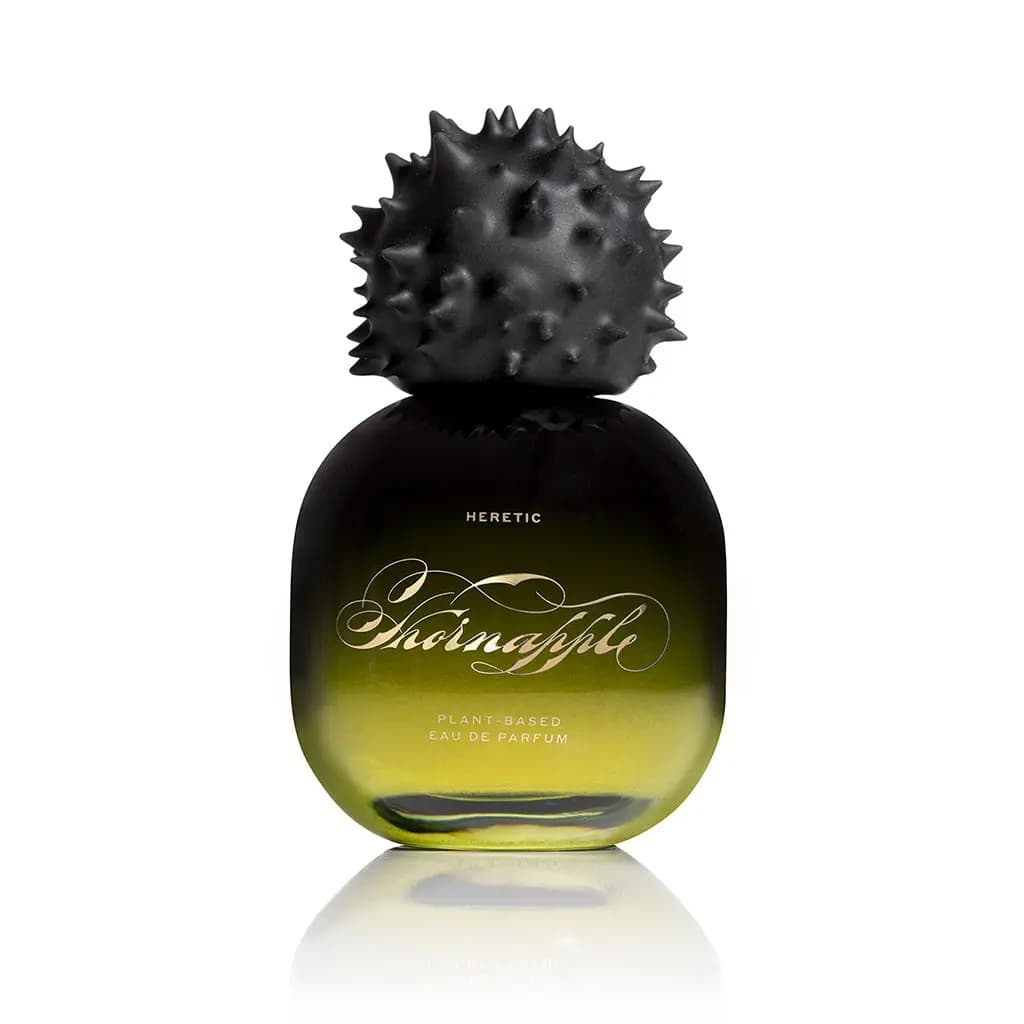 Heretic Thornapple Eau de Parfum in a rounded black-to-olive gradient bottle with a spiky matte black cap, on white.