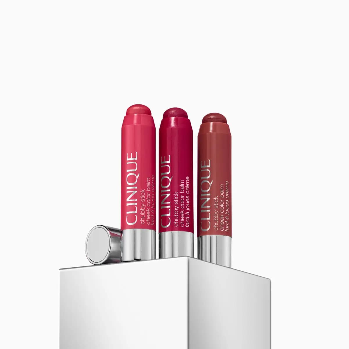 Three Chubby Stick Cheek Color Balms in bright pink, crimson and brick red