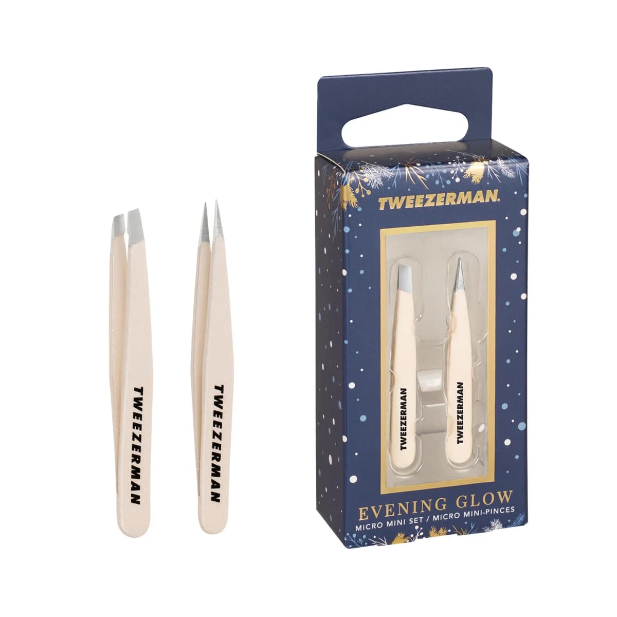 Evening Glow Micro Mini Set of two blush glitter tweezers, slant and pointed, next to a snowy navy gift box