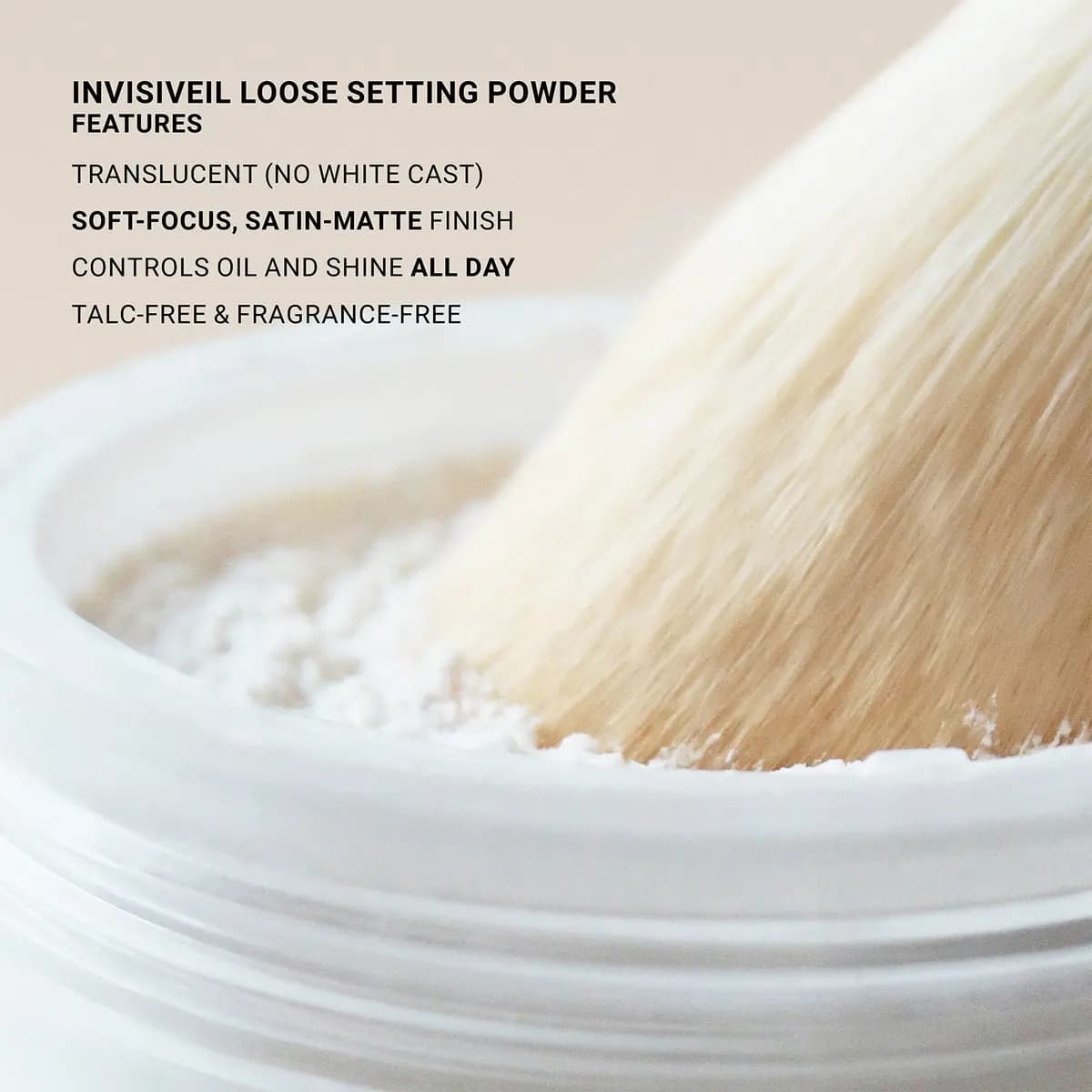 Close-up of a fluffy cream brush dipped into white powder, with text listing translucent, satin-matte features