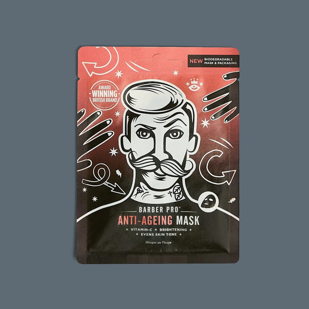 Red and black Barber Pro Anti-Ageing Mask sachet with illustrated moustached man on slate grey
