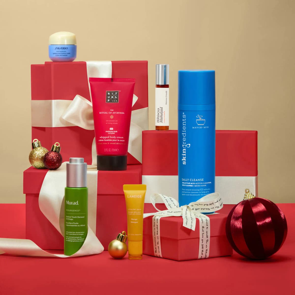 Rituals body cream, Skingredients Sally Cleanse, Murad oil drops, Laneige lip balm and Shiseido cream on gift boxes