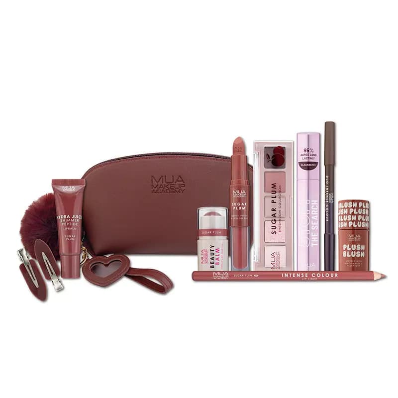 MUA Sugar Plum set laid out: plum bag, Hydra Juice balm, Sugar Plum palette, lilac mascara, liners and Plush Blush.