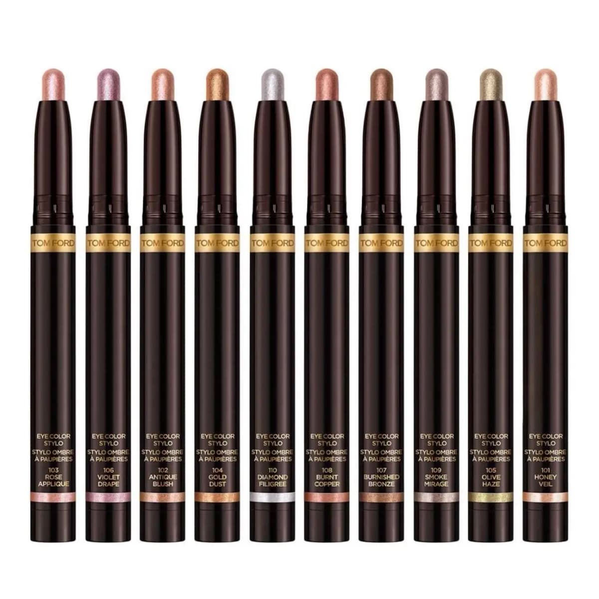 Ten TOM FORD Eye Color Stylo sticks in a row, shades 101 to 110, with dark brown barrels and shimmering tips