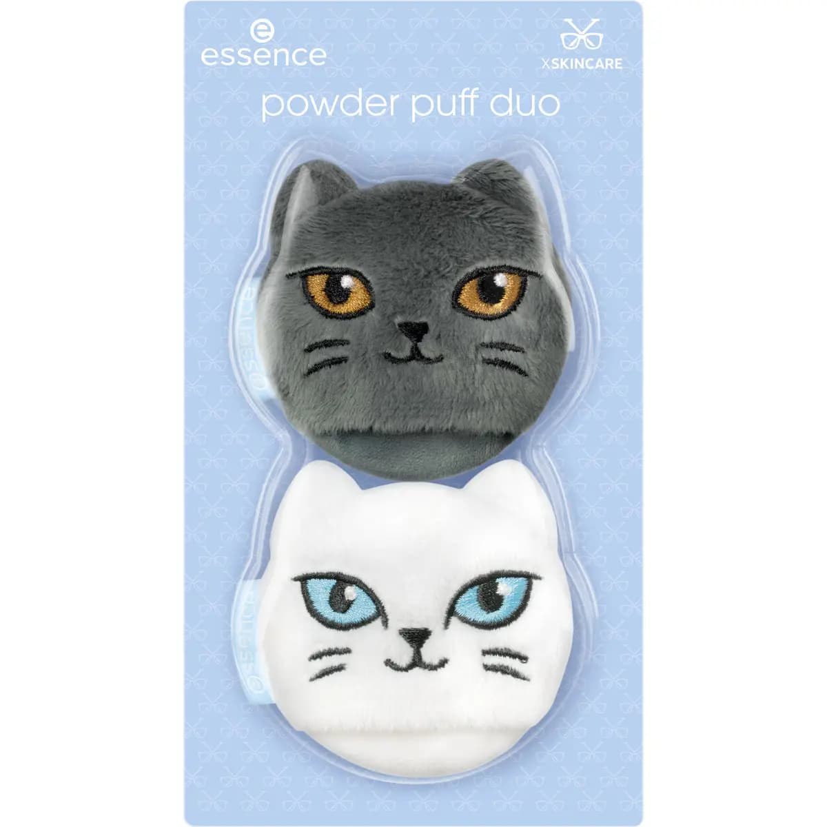 Powder puff duo blister card holding a grey cat puff with amber eyes and a white cat puff with blue eyes