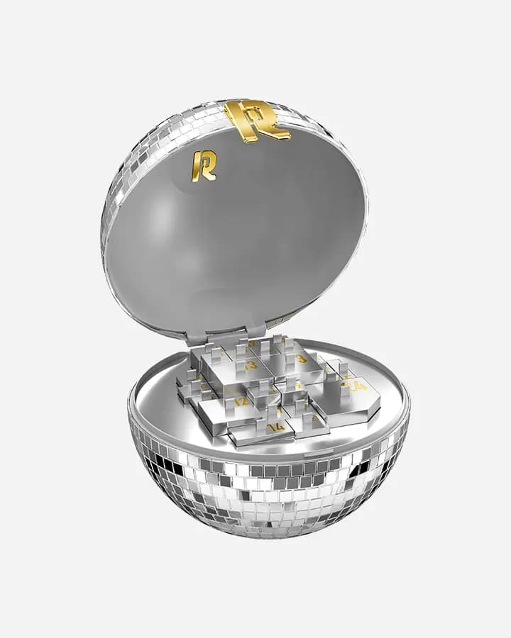 Open Rabanne disco-ball advent calendar showing gold R logo lid and silver numbered compartments arranged in the base.