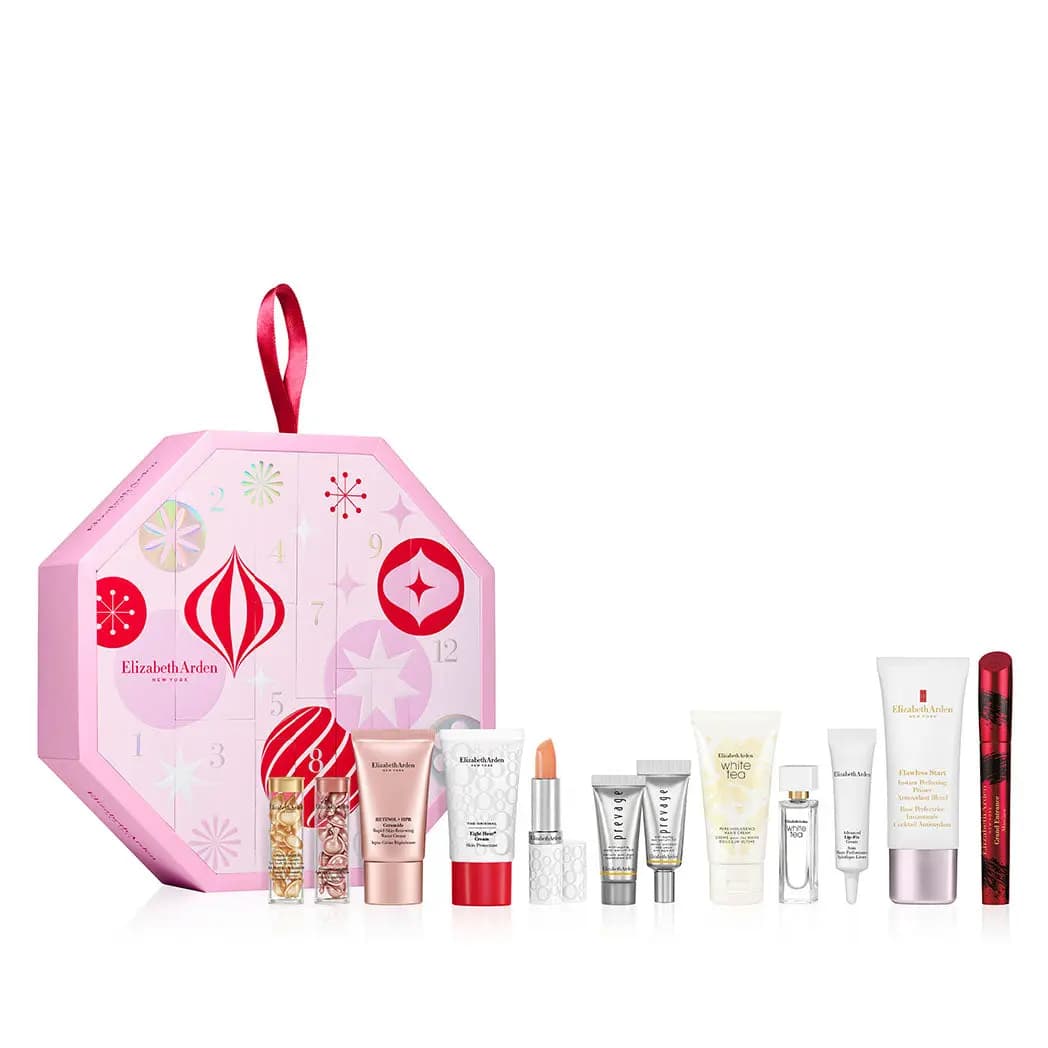 Pink octagonal Elizabeth Arden advent calendar with red ribbon beside its 12 skincare, makeup