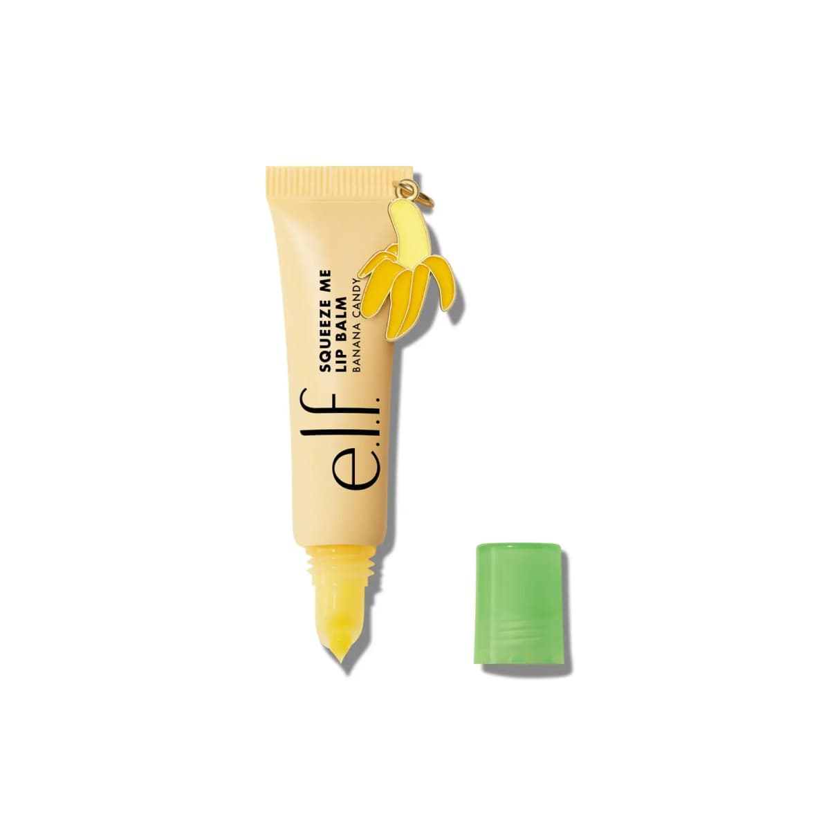 Pale yellow Banana Candy tube with peeled banana charm and yellow balm tip, green cap set beside it
