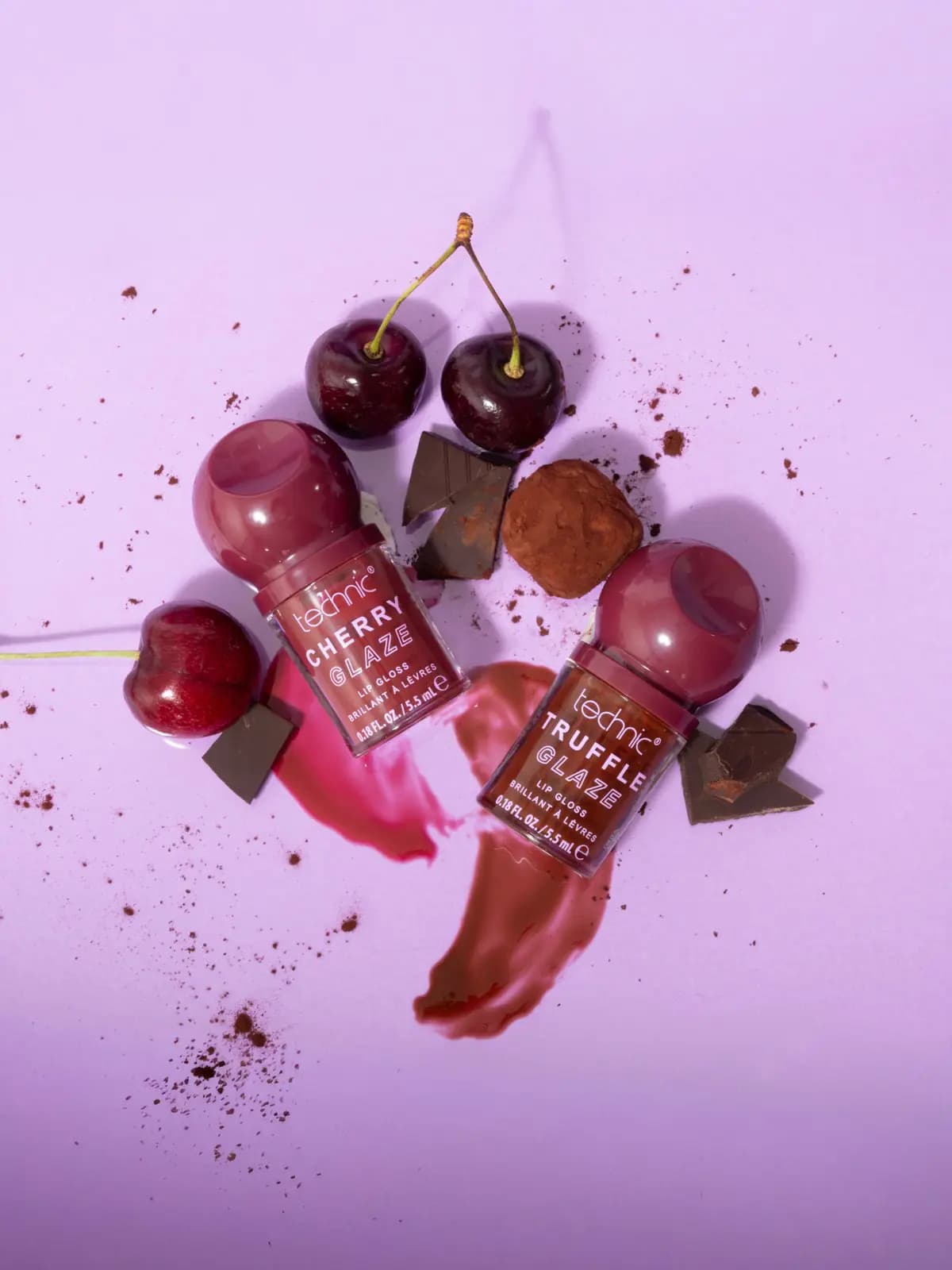 Cherry Glaze and Truffle Glaze lip glosses with glossy pink and brown swatches, cherries, chocolate and a truffle