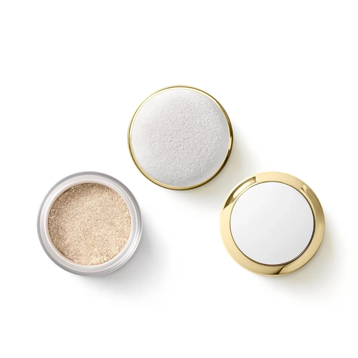 Loose champagne glitter powder jar beside a white velour puff applicator and gold mirrored lid