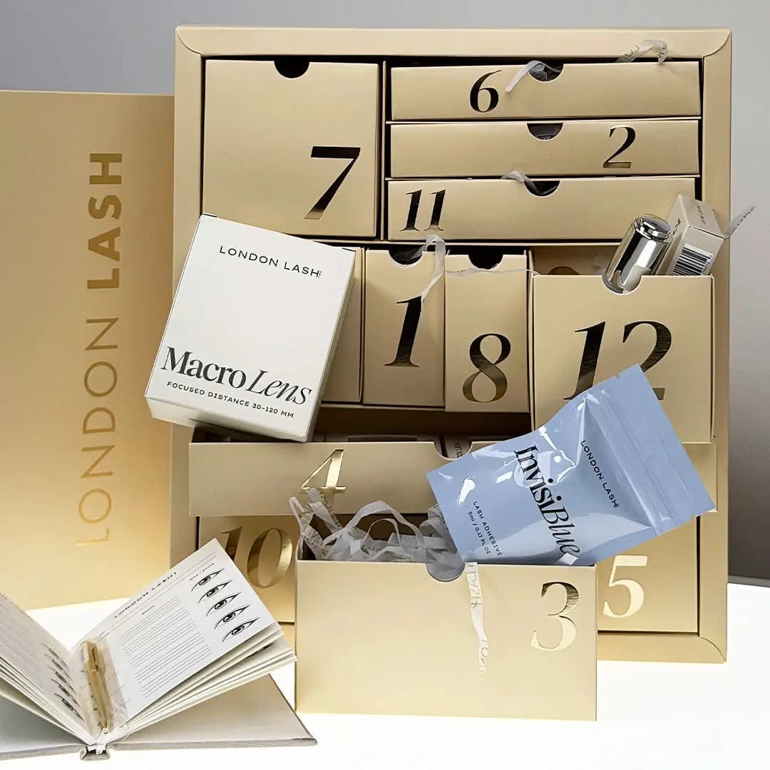 London Lash calendar with drawers open showing Macro Lens box, InvisiBlue adhesive sachet and other lash products