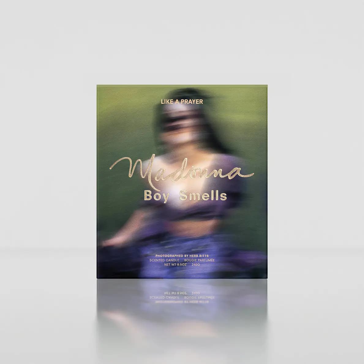 Like a Prayer box with a blurred green and purple portrait, gold Madonna script and Herb Ritts photo credit