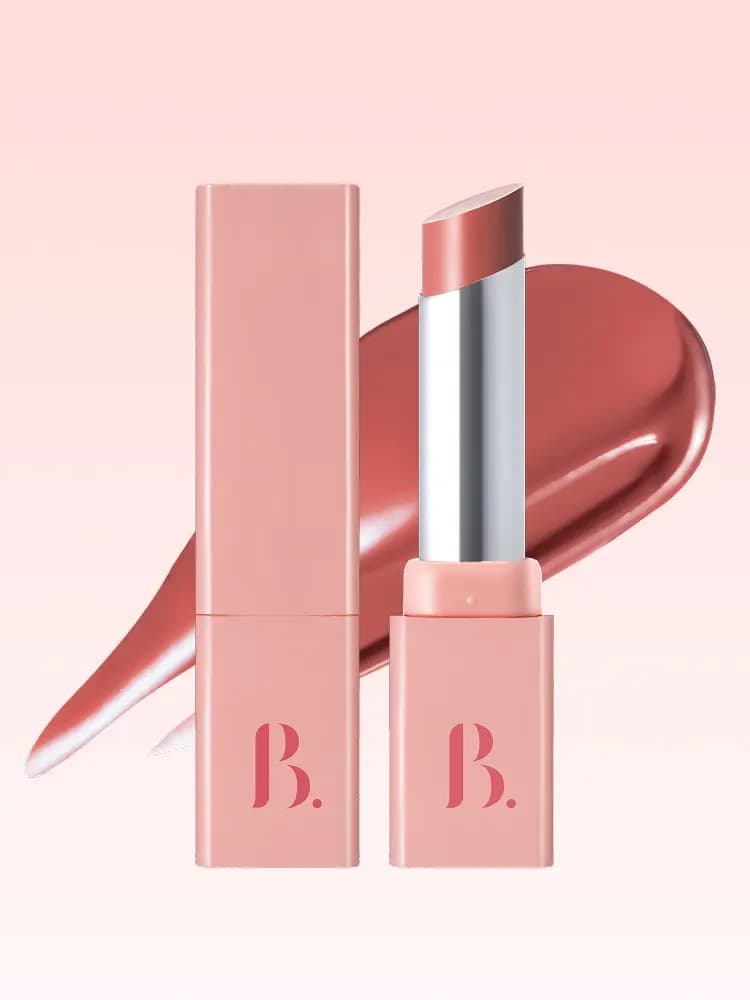 Peach-pink square lipstick case beside an open nude rose bullet with a glossy coral-rose swatch