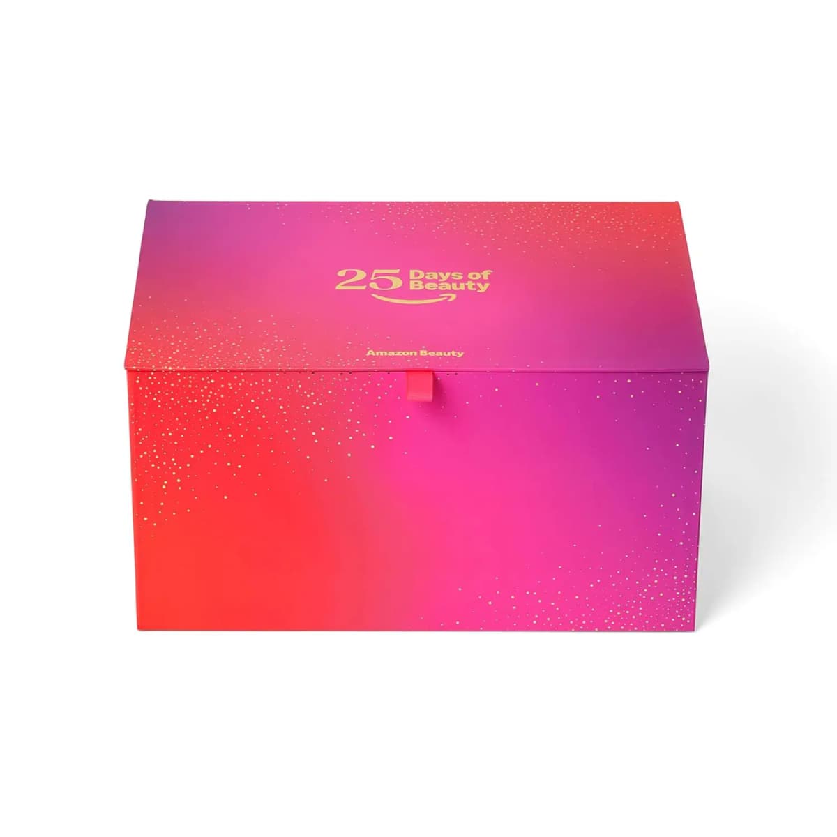 Closed Amazon Beauty 25 Days of Beauty box with a red-pink-purple gradient, gold confetti and a pink ribbon pull tab