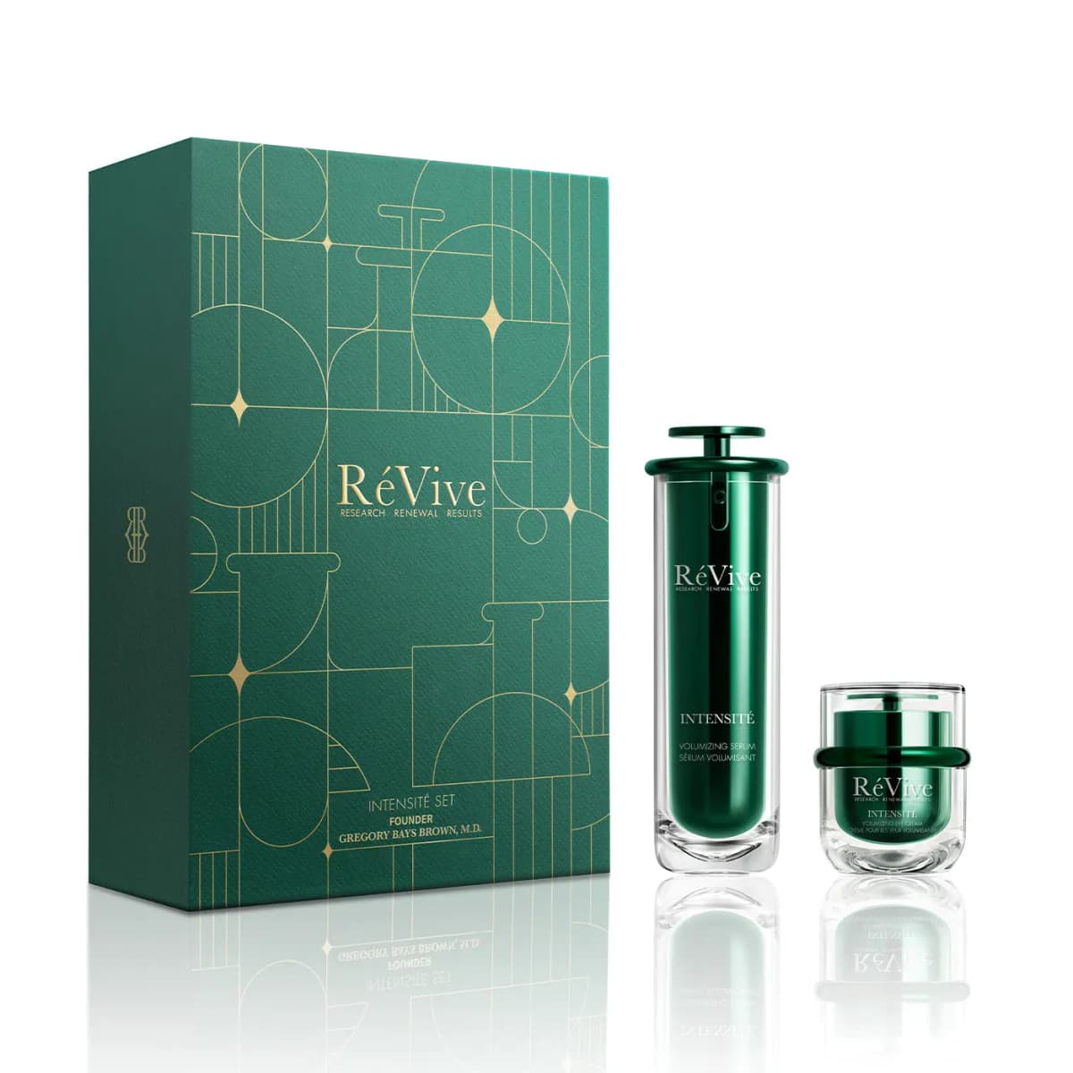 Intensité Set box beside green Intensité Volumizing Serum pump bottle and Volumizing Eye Cream jar on white