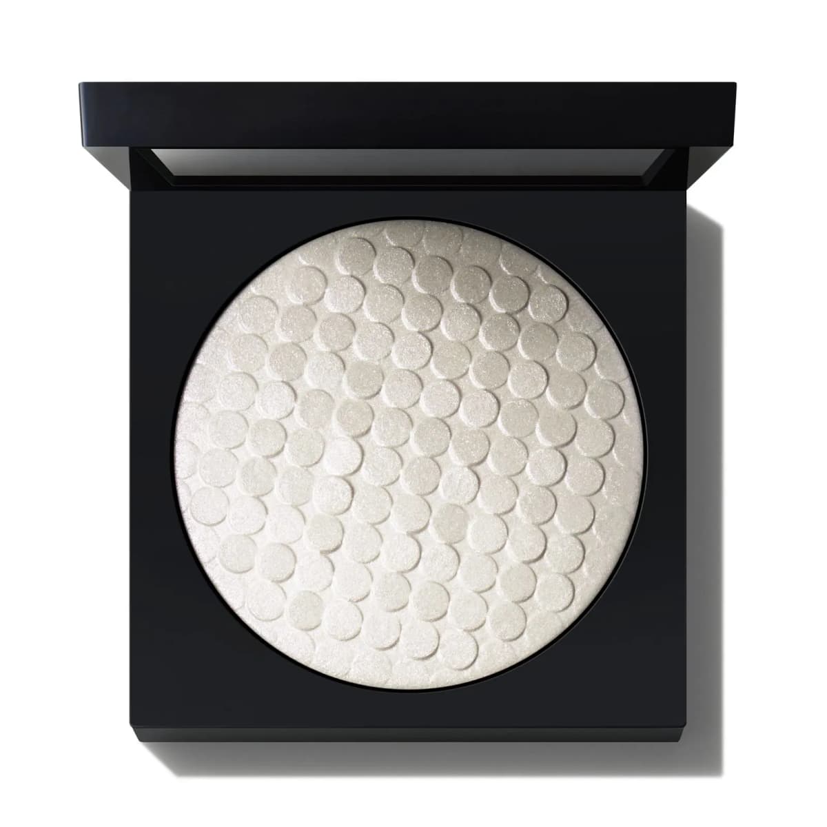 Pearly white highlighter embossed with overlapping circles in a square black compact.