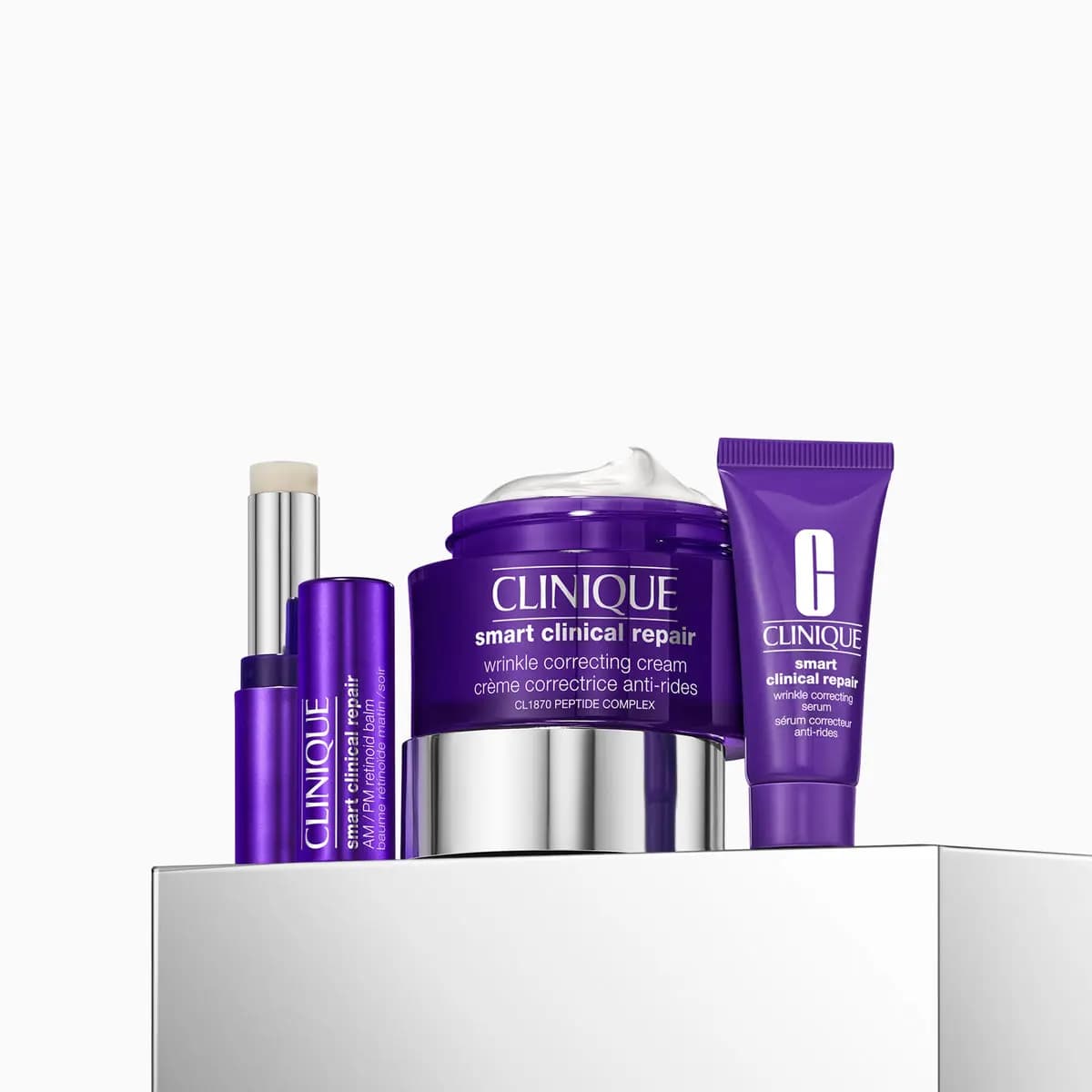 Purple Smart Clinical Repair wrinkle correcting cream, retinoid balm stick and serum tube