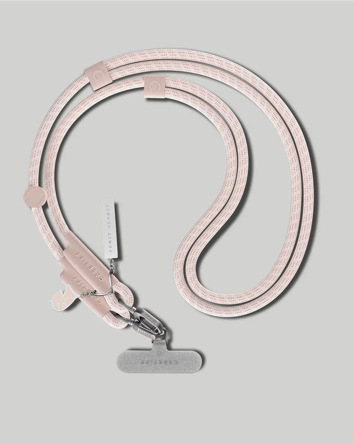 Blush pink rope phone strap with Fenty Beauty tag, FB charm, silver clips and a grey tether card