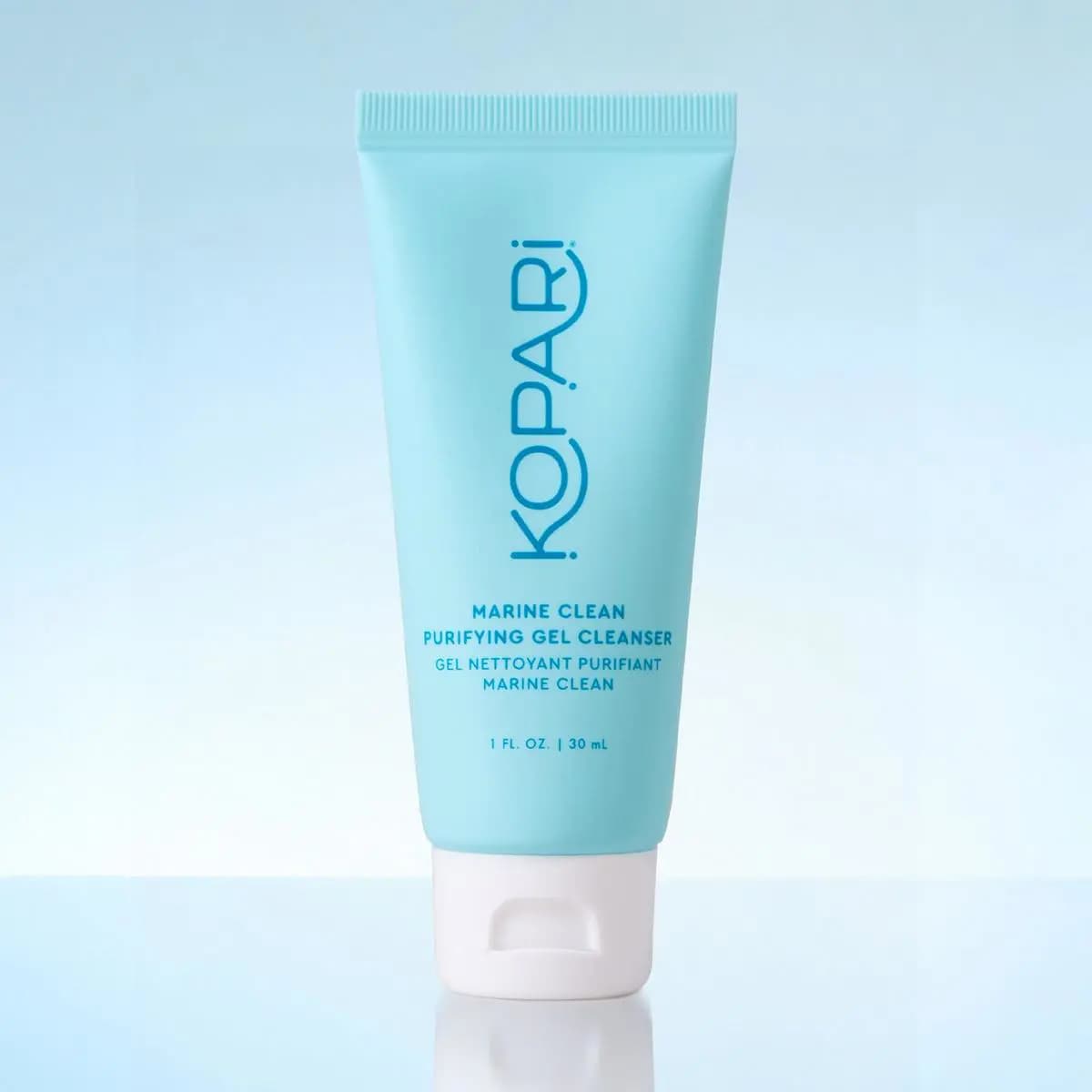 Light aqua squeeze tube of Marine Clean Purifying Gel Cleanser, 30 mL, with a white flip cap on a pale blue backdrop