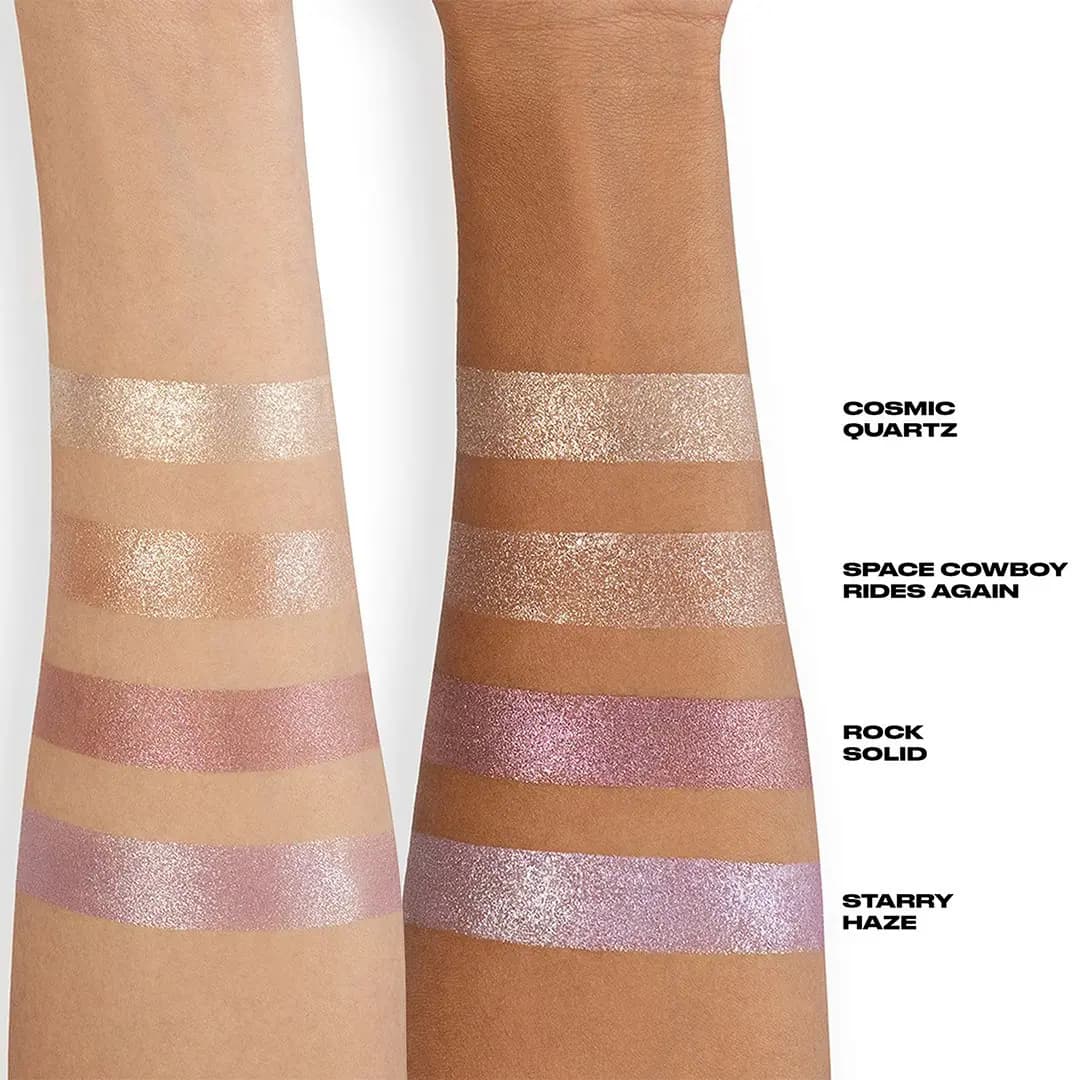Swatches of the four Urban Decay Moondust Full Shimmer Quad shades on light and deep skin