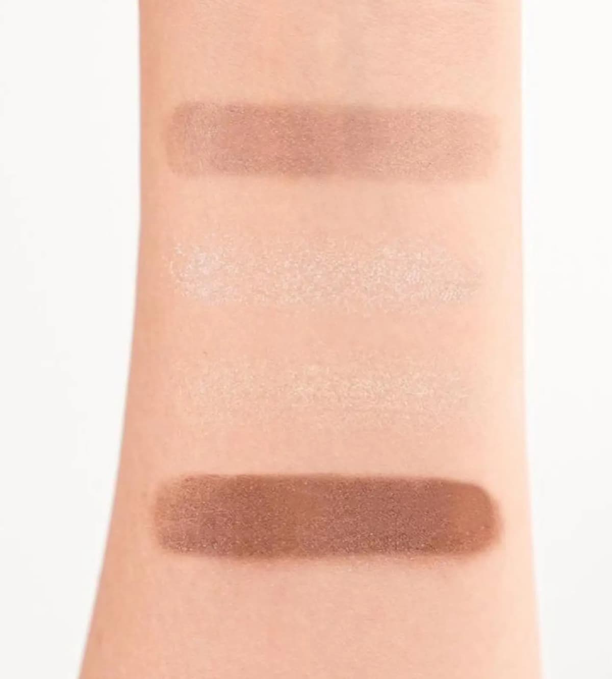 Arm swatches of the four Chanel Holiday 2026 eyeshadow quad shades