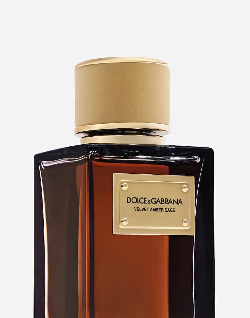 Close-up of the riveted gold plaque reading Velvet Amber Sage beneath a matte tan velvet-wrapped cap