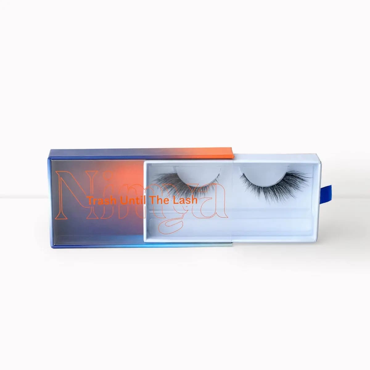 Nimya lash packaging displaying a bold, dramatic voluminous strip lash pair inside.
