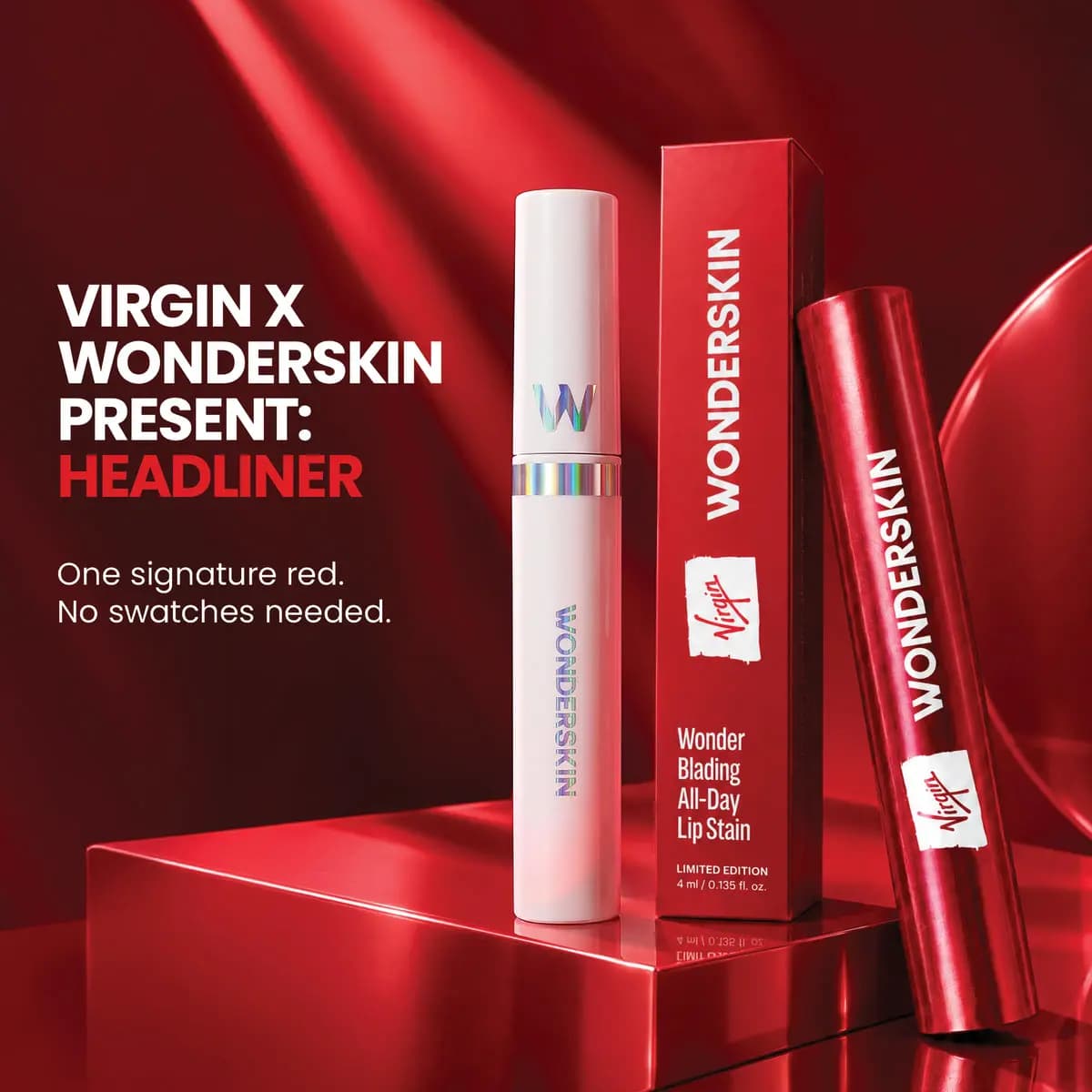 White Headliner tube beside red Virgin-branded box and red metallic tube on a glossy red plinth