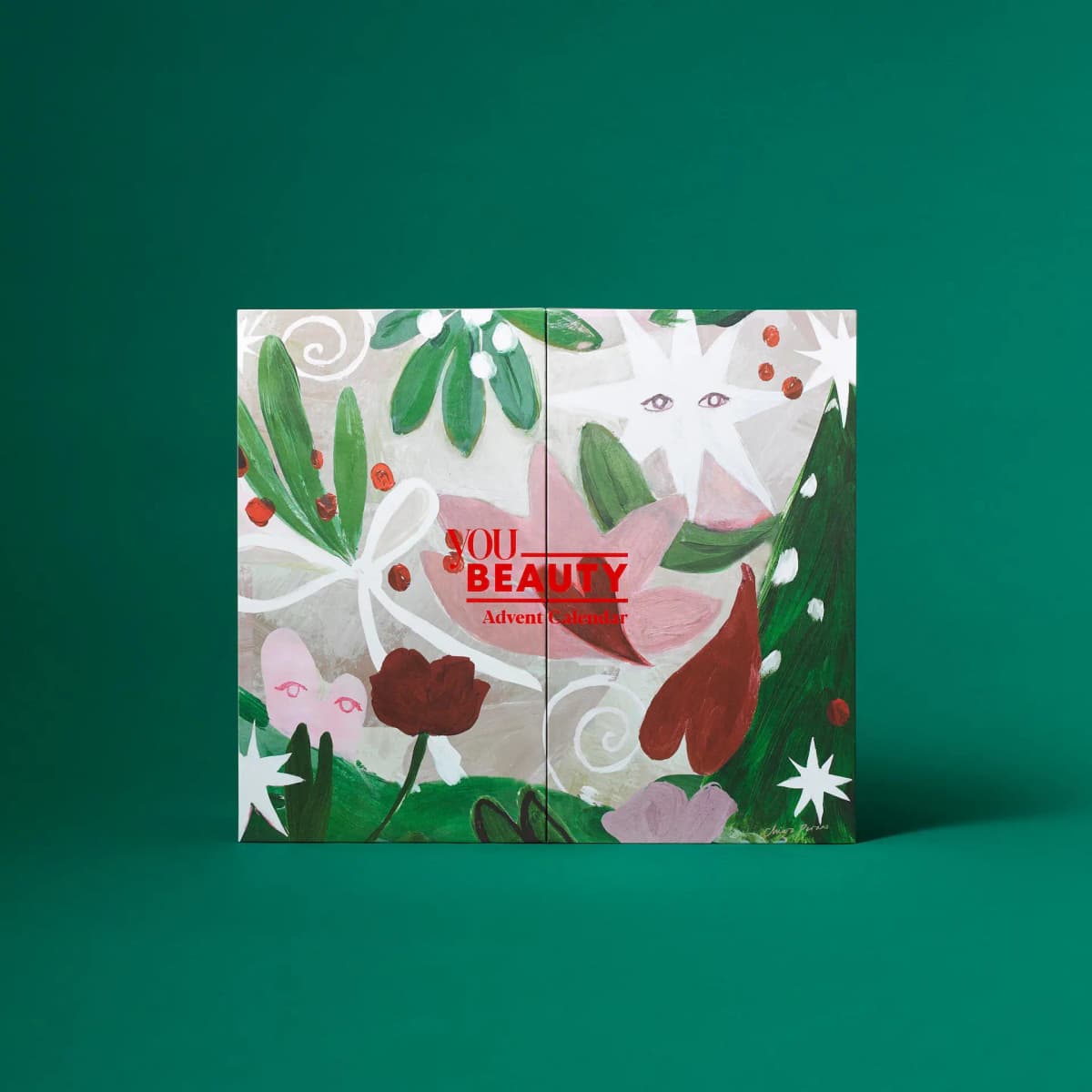 YOU Beauty Advent Calendar 2026 closed box with painted festive foliage, stars and red berries on a green backdrop