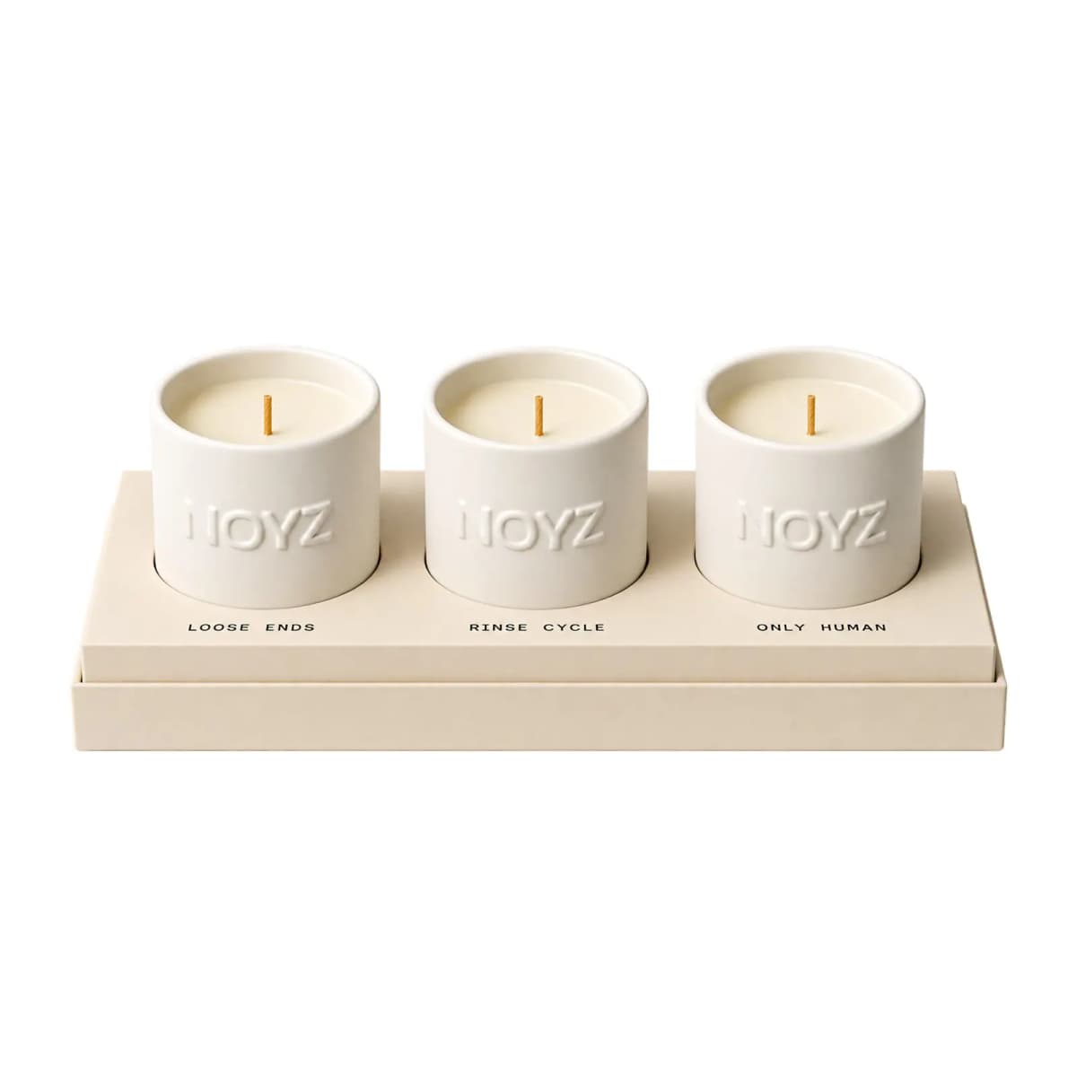 Mini Candle Trio of embossed white ceramic candles labelled Loose Ends, Rinse Cycle and Only Human in a beige box