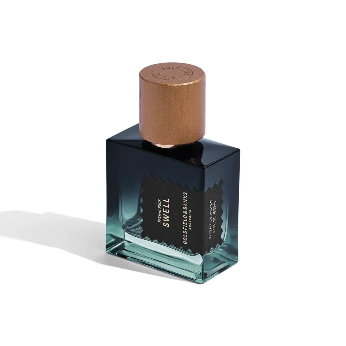50ml Pacific Rock Swell Extrait de Parfum bottle with black wavy-edged label and engraved wooden cap