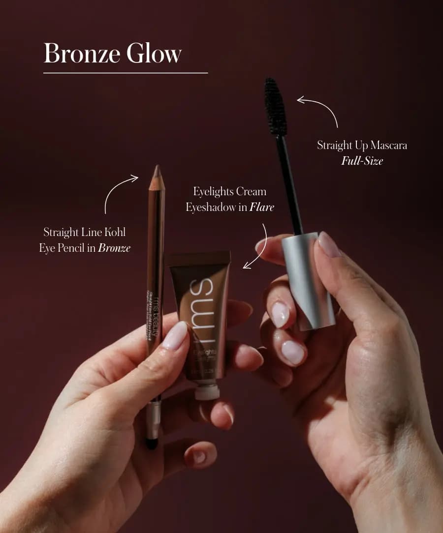 Hands hold the Bronze Glow trio, labelled Bronze kohl pencil, Flare Eyelights shadow and full-size mascara