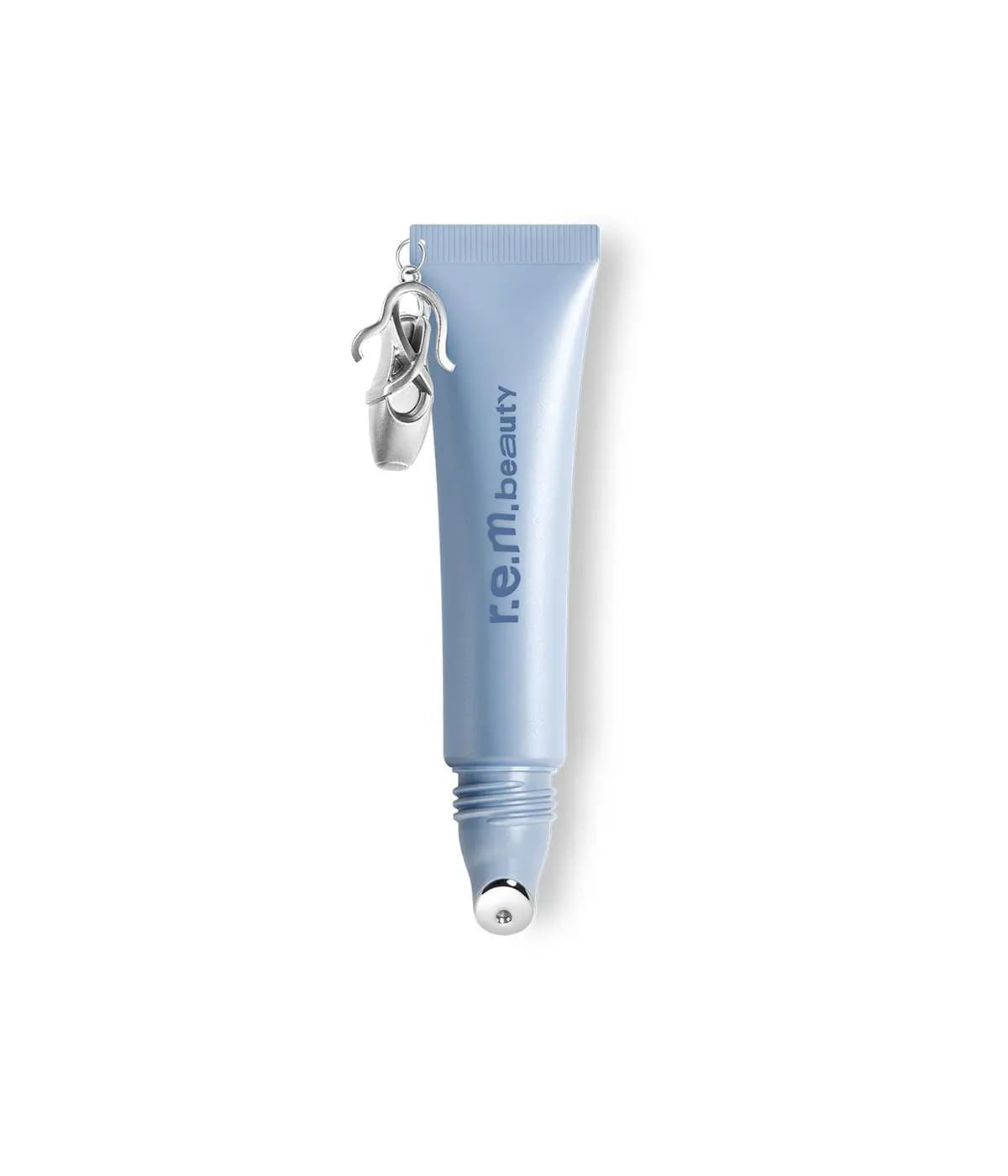 Pale blue Satin Slumber lip mask tube with a metal roller tip and a silver ballet slipper charm