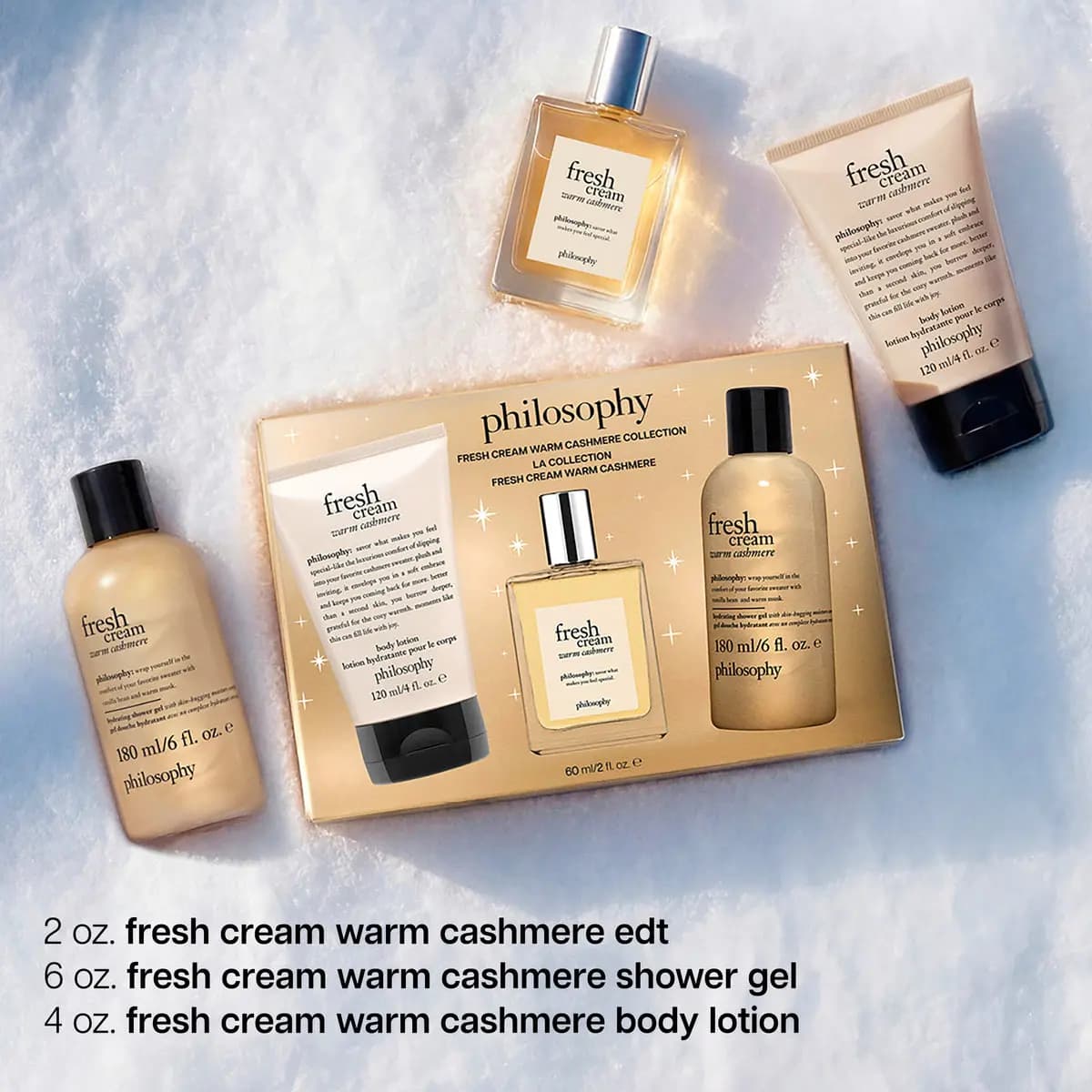 Gold philosophy fresh cream warm cashmere collection box with edt, shower gel and body lotion tube set on snow