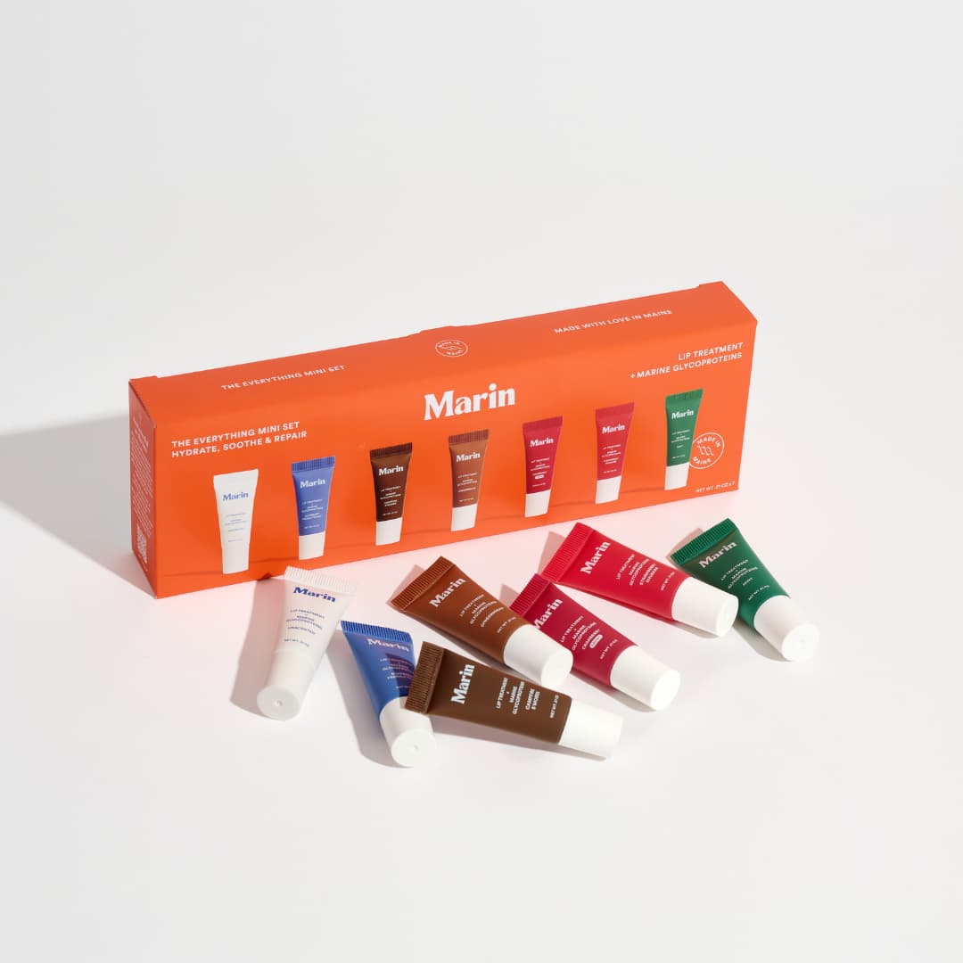 Orange Everything Mini Set box with its seven mini tubes in white, blue, brown, red and green scattered in front