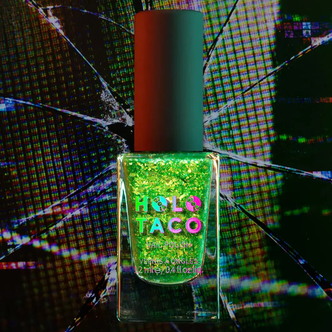 Bottle of bright green jelly polish full of gold-green iridescent flakes against a glitchy background