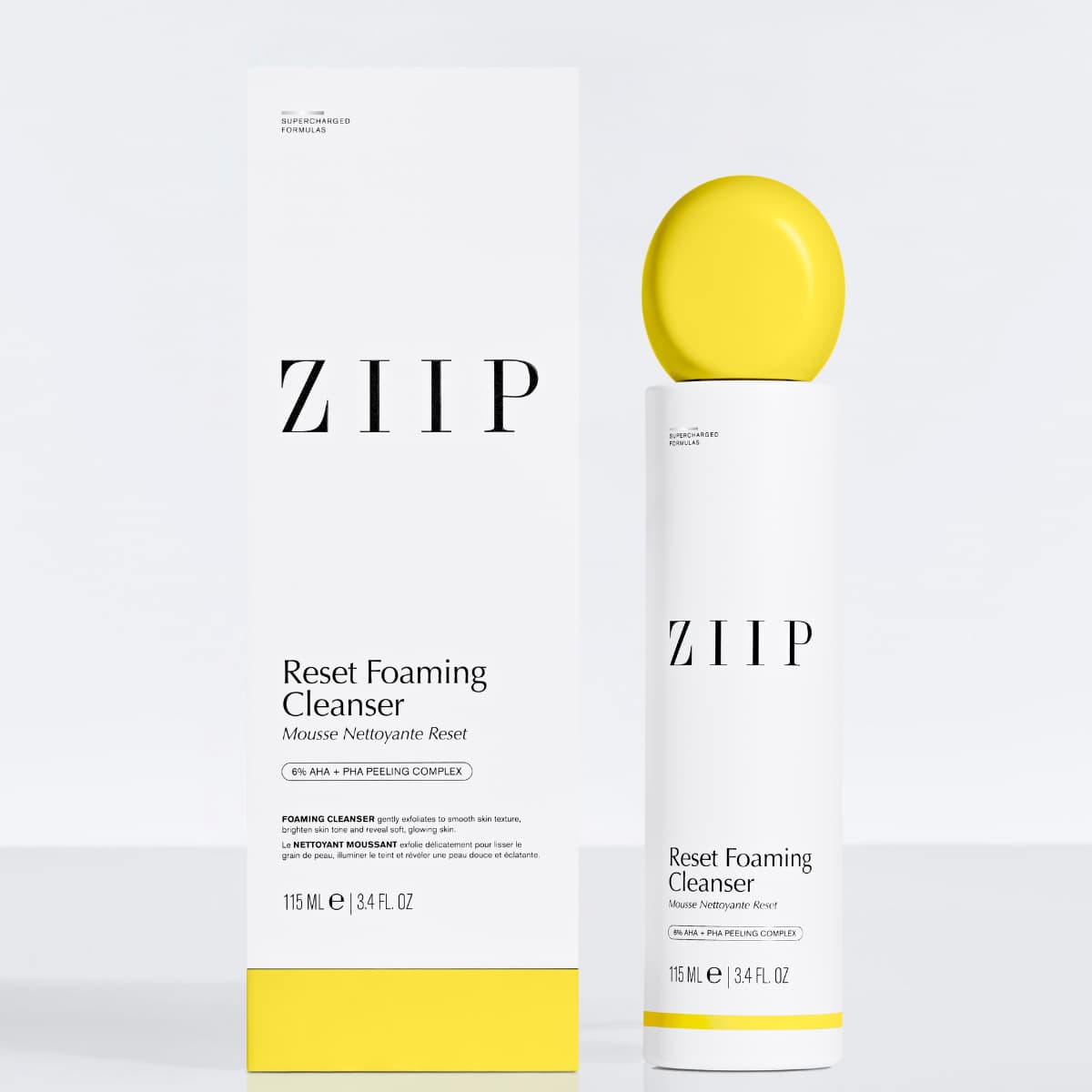Cleanser bottle beside its white and yellow carton labelled 6% AHA + PHA peeling complex, 115 ml