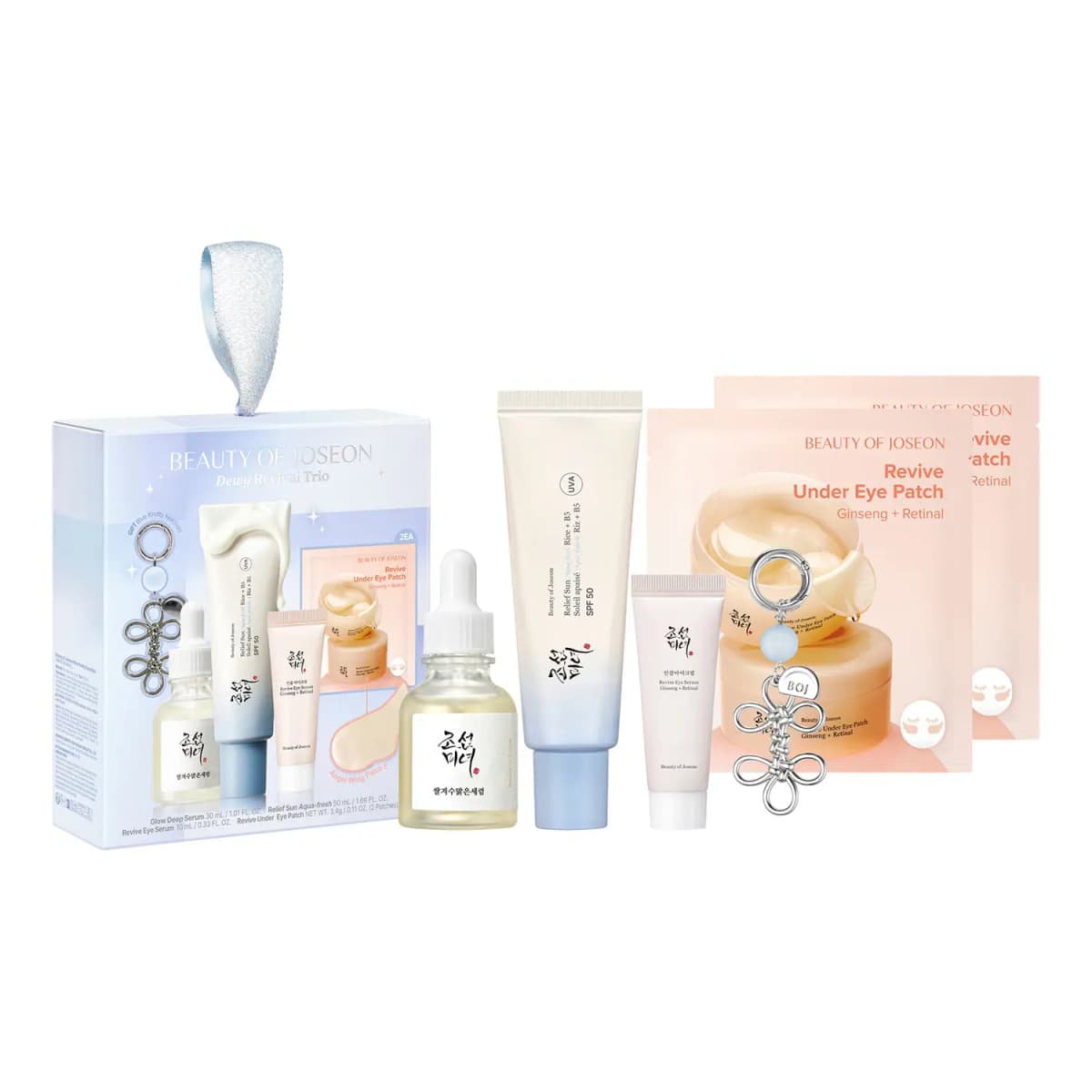 Beauty of Joseon Dewy Revival Trio gift set: pale-blue box, serum, SPF 50 tube, eye serum, two peach eye patches, keychain