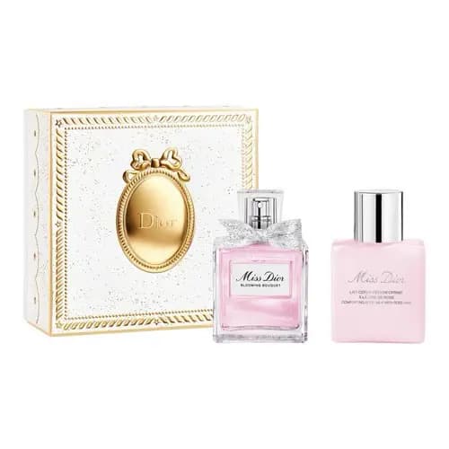 White and gold cameo medallion box with a pink Miss Dior Blooming Bouquet perfume and pink body milk bottle