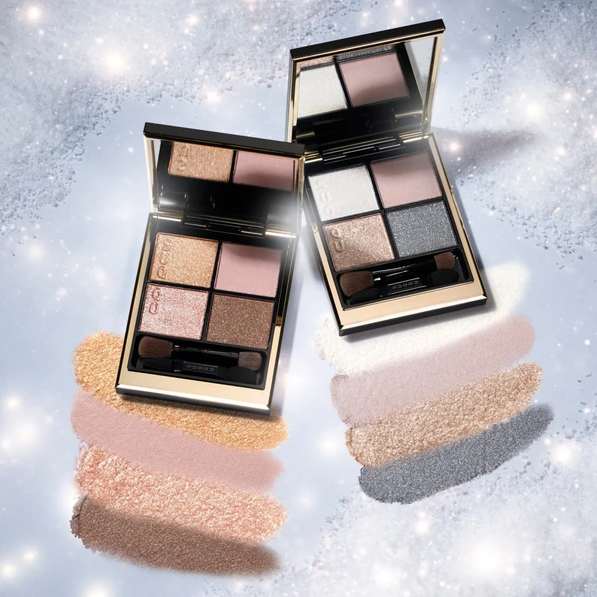 Both eyeshadow palettes open on an icy backdrop above swipes of their warm and cool shimmer shades