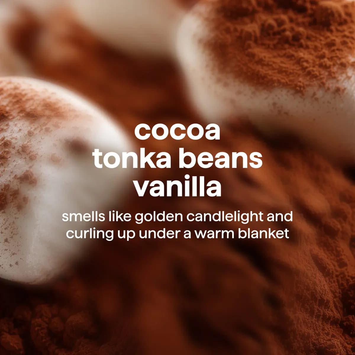 Blurred cocoa-dusted marshmallows with text "cocoa, tonka beans, vanilla" and a candlelight and warm blanket scent line