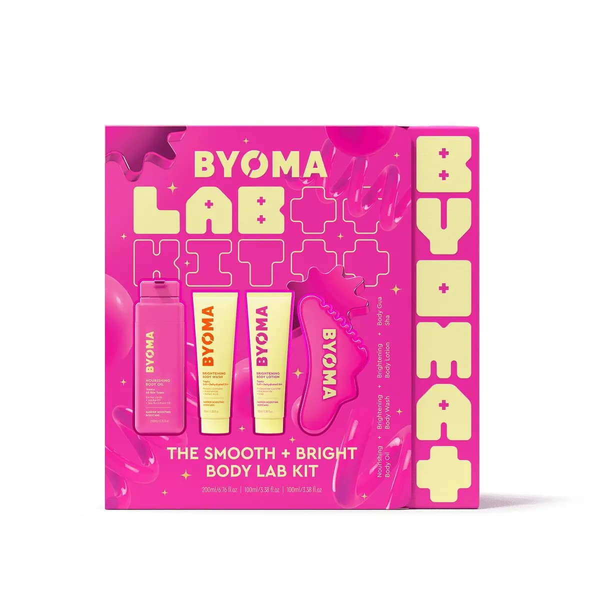 Pink box for The Smooth + Bright Body Lab Kit with body oil, wash, lotion and pink gua sha