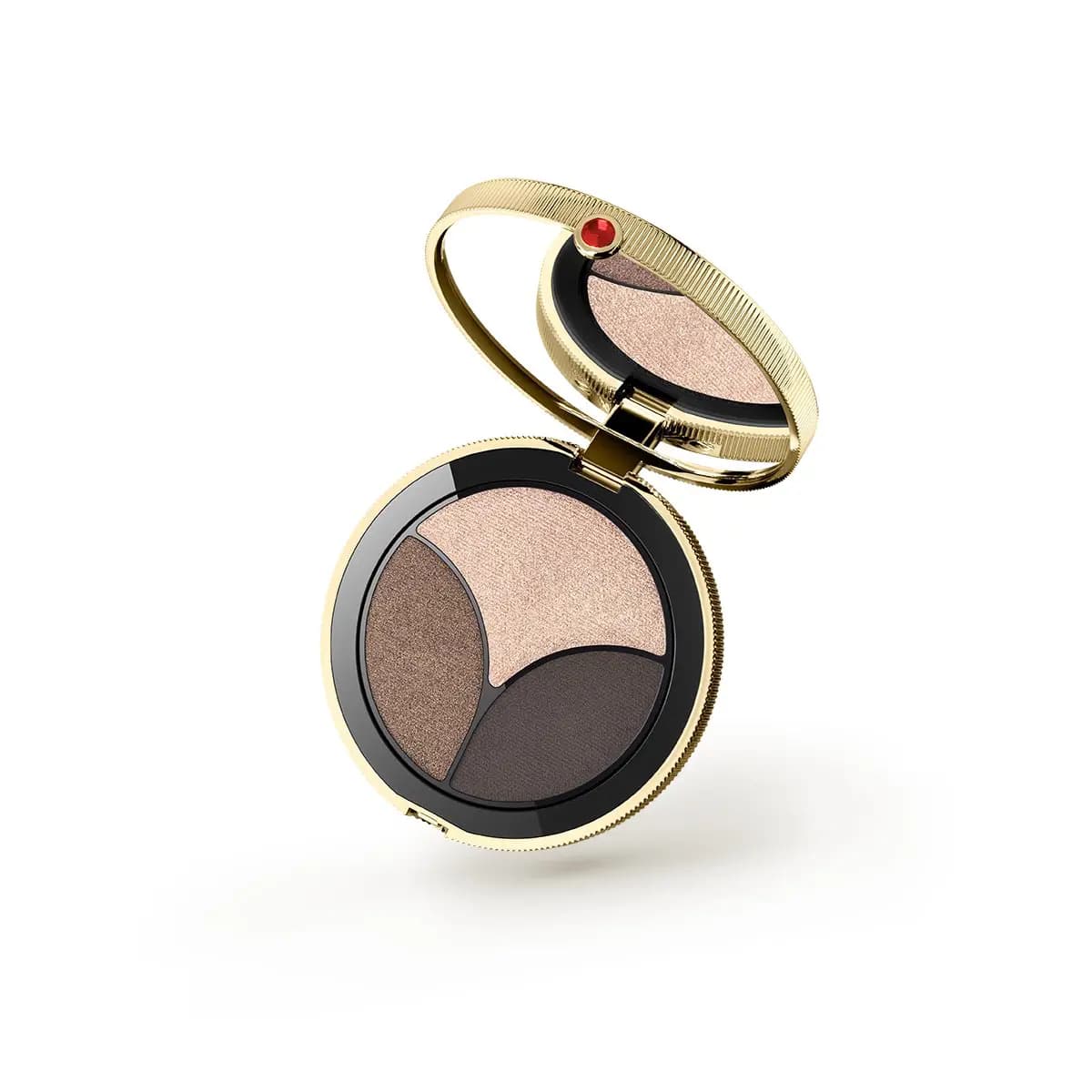 Round gold compact with red jewel holding an eyeshadow trio in pale pink shimmer, bronze and dark brown
