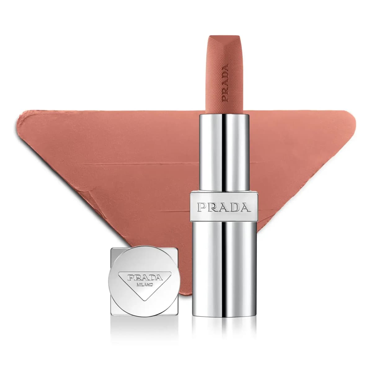 Matte peachy-nude lipstick in all-silver tube and cap in front of a triangular peach swatch