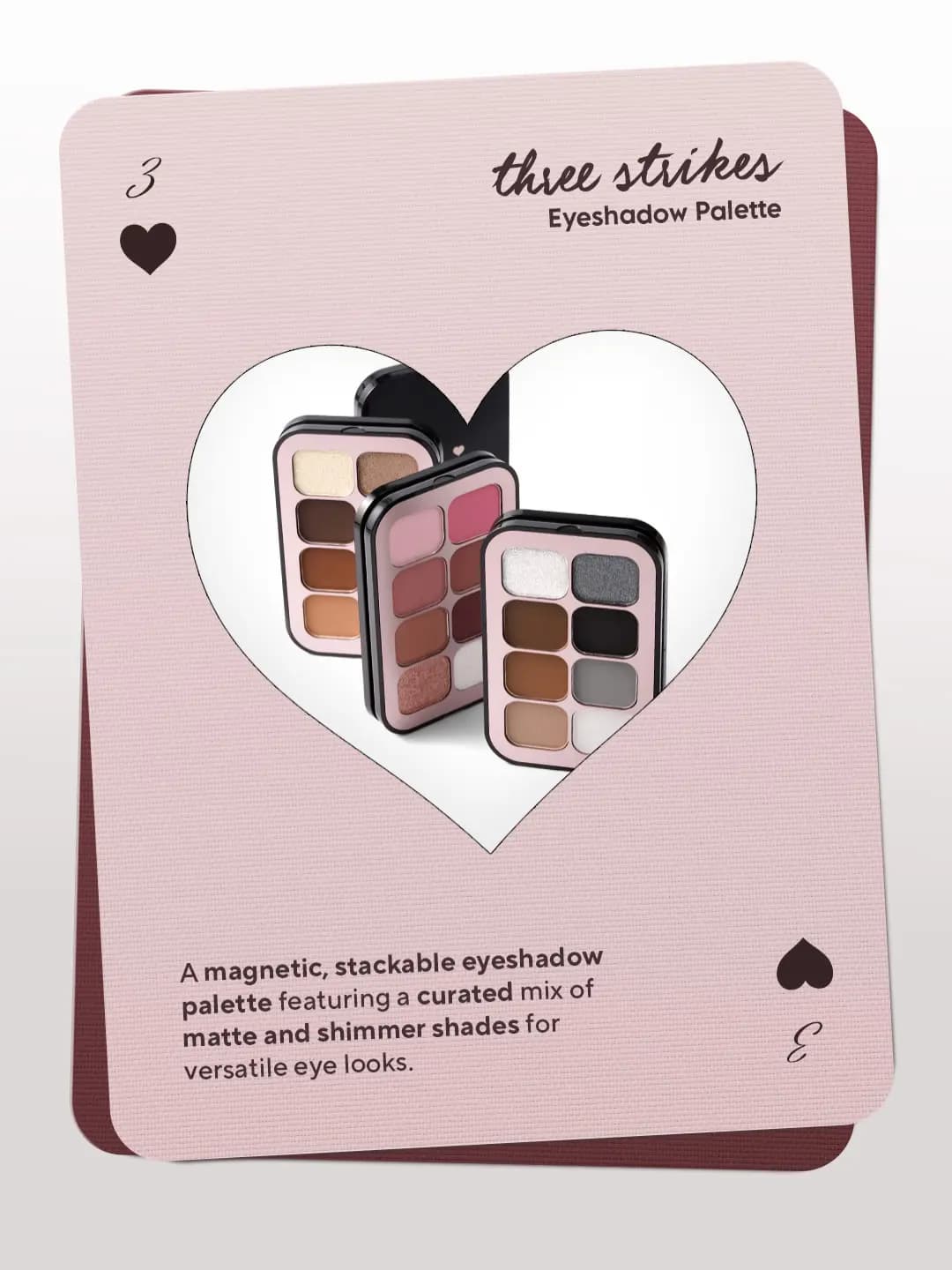 Playing-card graphic for the Vice Cosmetics Three Strikes Eyeshadow Palette showing three stacked palettes in a heart frame
