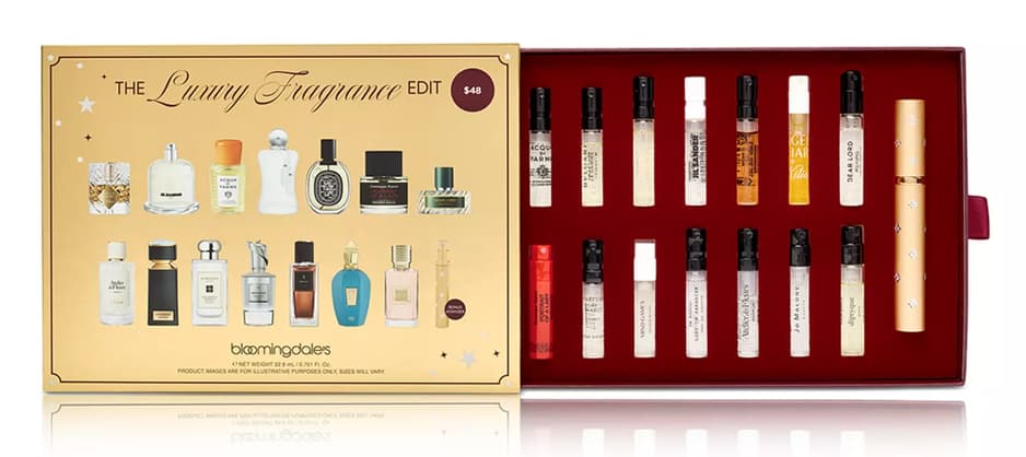 Bloomingdale's Luxury Fragrance Edit set displaying printed mini bottles on gold lid and 14 sample sprays inside.